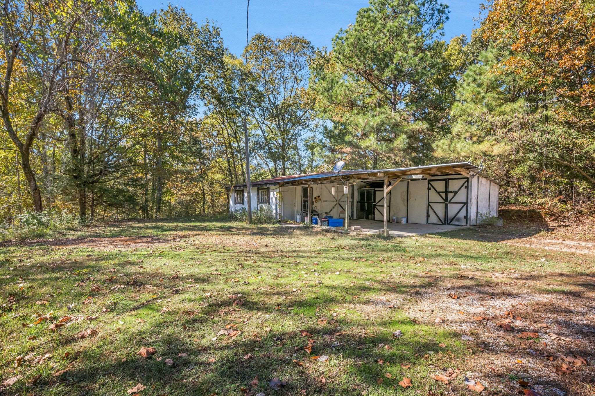 1865 Clydeton Road Waverly, TN 37185 - Photo 30 of 40 a house with swimming pool in front of it