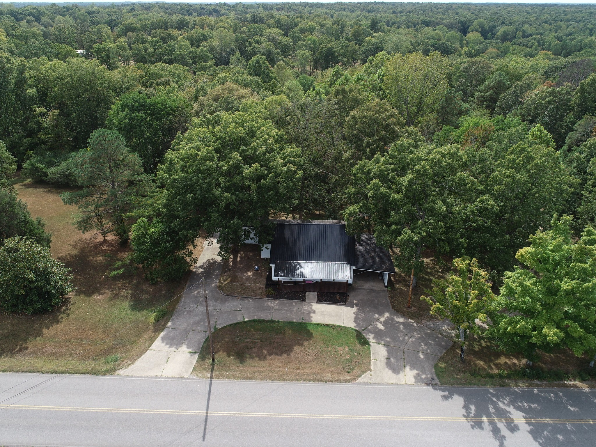 1865 Clydeton Road Waverly, TN 37185 - Photo 34 of 40 an aerial view of a house with pool outdoor seating and yard