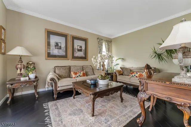 a kitchen with a dining table chairs and refrigerator