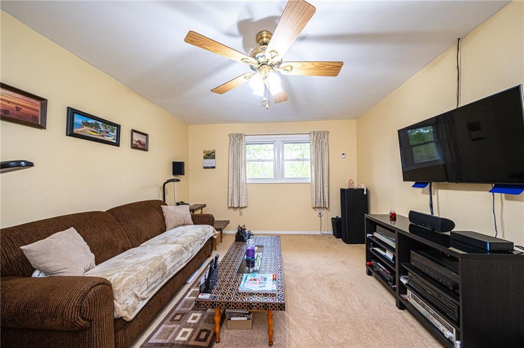 341 Pittsburgh Grade Road Hookstown, PA 15050 - Photo 8 of 23 Living Room with Neutral Decor and Ceiling Fan.