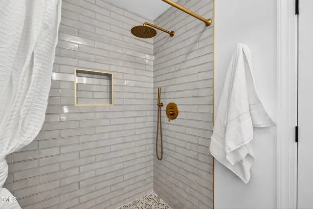 a view of hallway with wooden floor