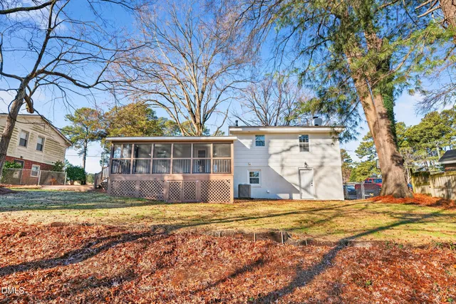 a view of house with yard