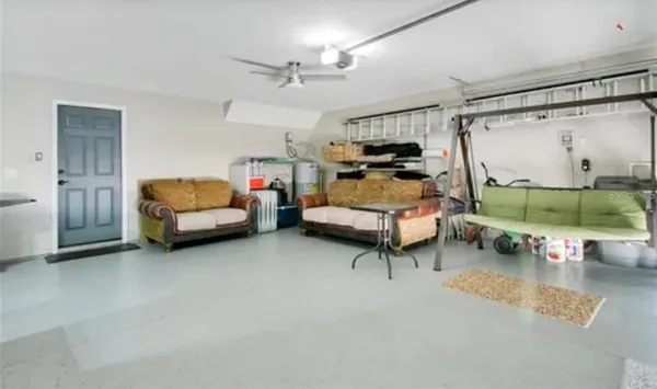 a bed room with furniture and a flat screen tv