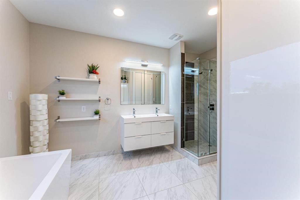 4013 Ivanhoe Lane Dallas, TX 75212 - Photo 16 of 38 Bathroom with vanity and independent shower and bath
