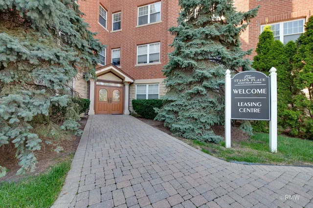 a sign board with yard in the back