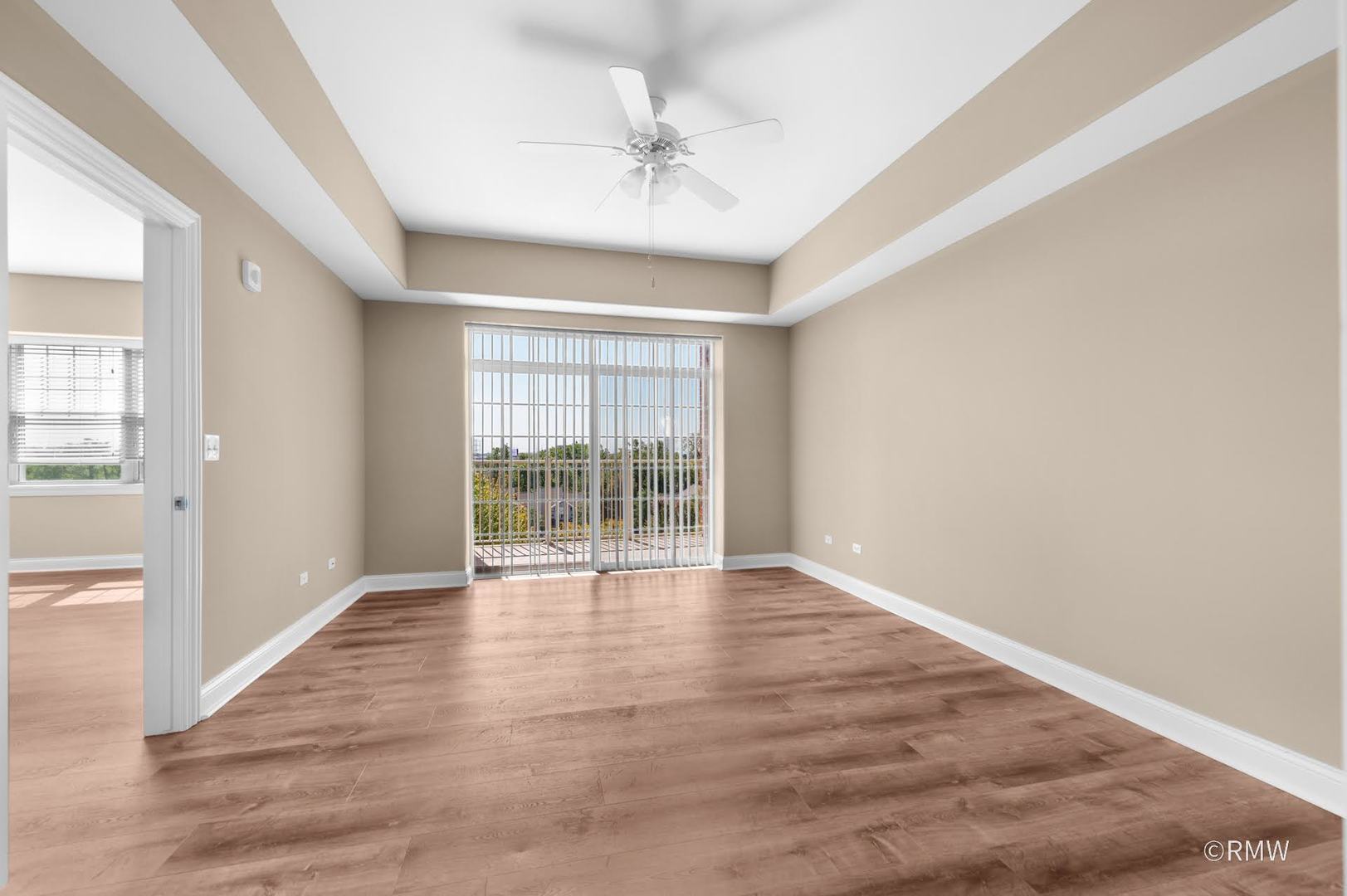 2 Itasca Place, Unit 521 Addison, IL 60143 - Photo 11 of 20 wooden floor in an empty room with a window