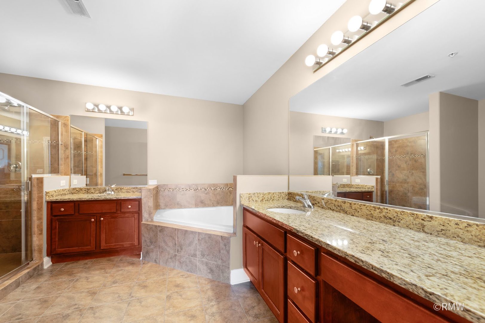 2 Itasca Place, Unit 521 Addison, IL 60143 - Photo 12 of 20 a bathroom with a granite countertop double vanity sink and mirror