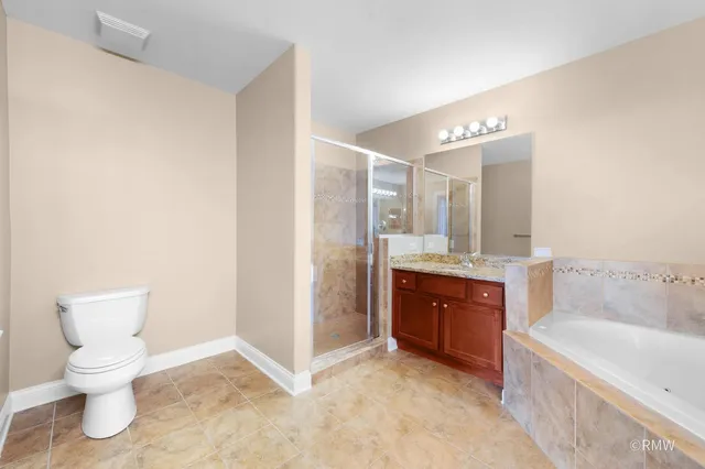 a bathroom with a bathtub sink and toilet