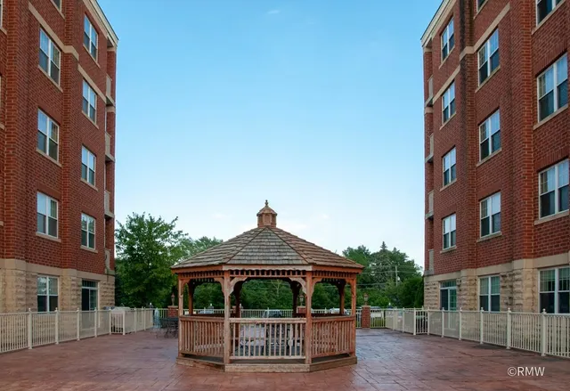 a front view of a building with garden