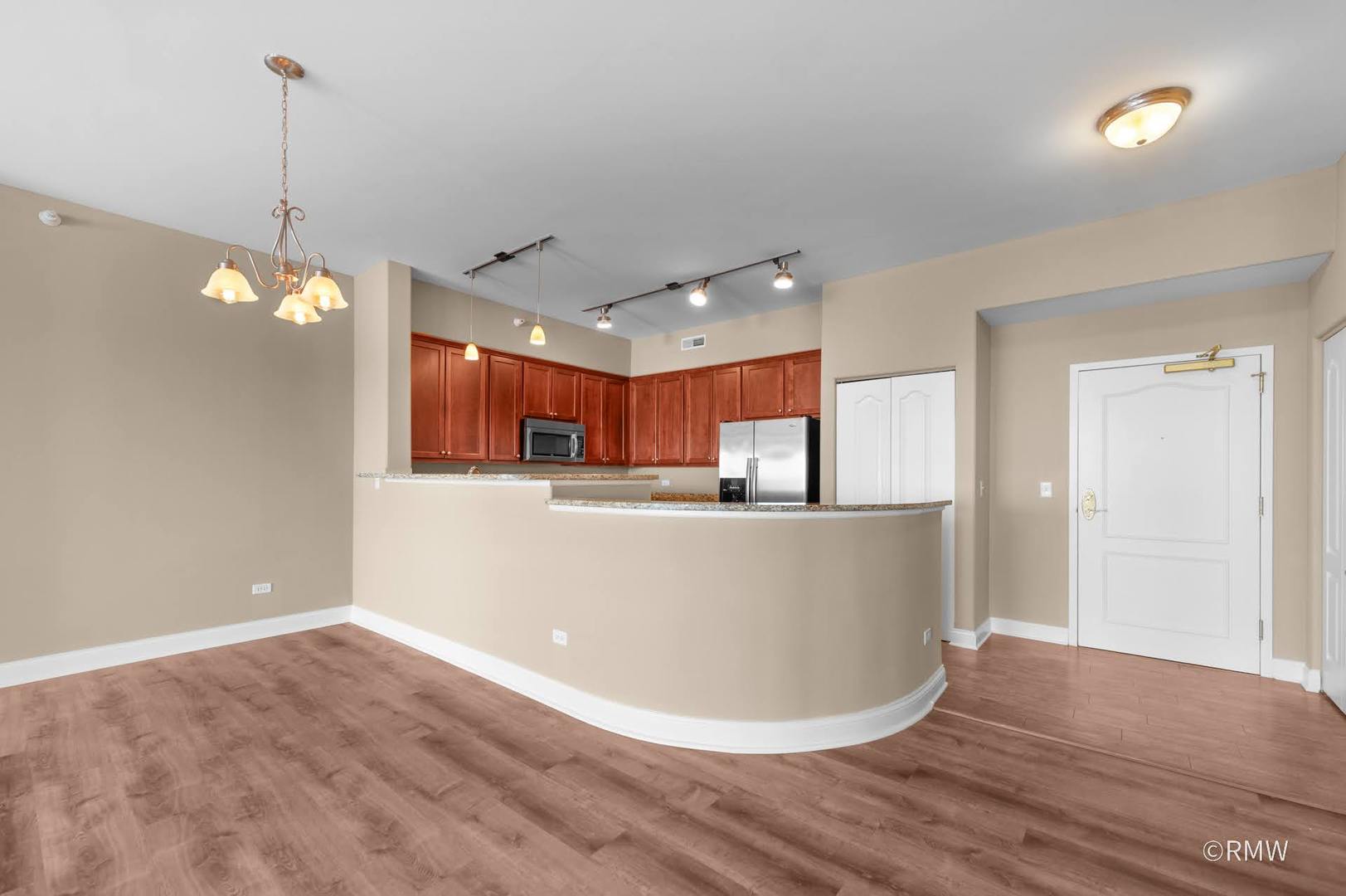 2 Itasca Place, Unit 521 Addison, IL 60143 - Photo 6 of 20 a view of a living room and kitchen