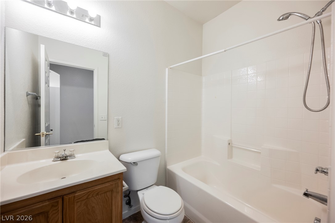 6320 Snap Ridge Street, Unit 201 North Las Vegas, NV 89081 - Photo 13 of 56 A well-appointed bath offers a convenient tub-shower combination and a clean, functional vanity.
