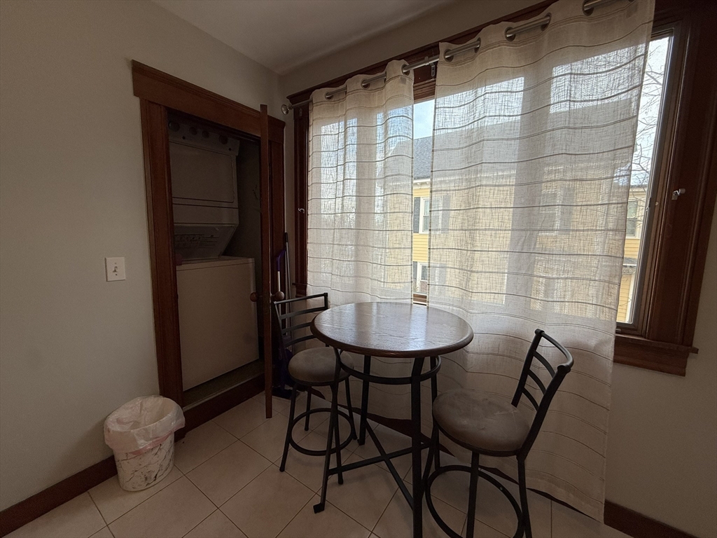 22 Yale Avenue, Unit A Wakefield, MA 01880 - Photo 15 of 23 a view of a room with a table and chairs