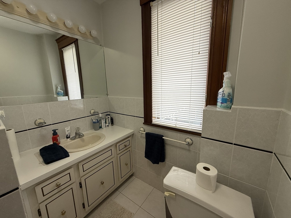 22 Yale Avenue, Unit A Wakefield, MA 01880 - Photo 16 of 23 a bathroom with a sink and a washing machine