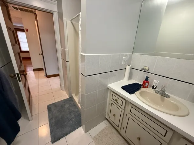 a bathroom with a sink and mirror