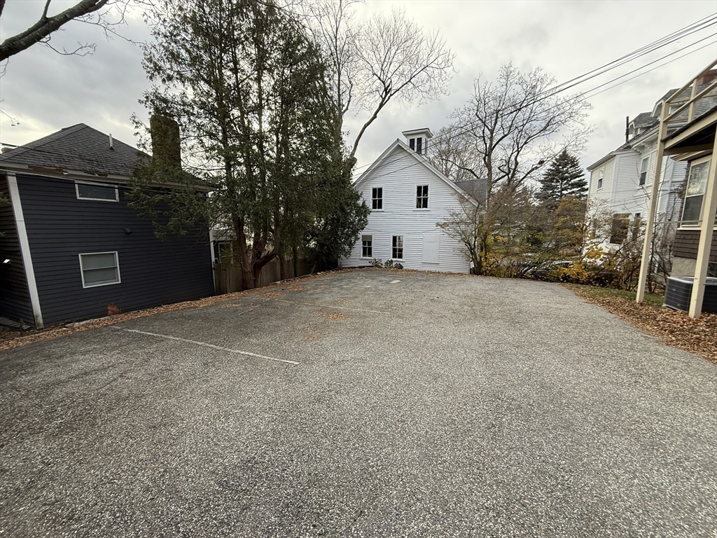 22 Yale Avenue, Unit A Wakefield, MA 01880 - Photo 20 of 23 a view of a house with a yard