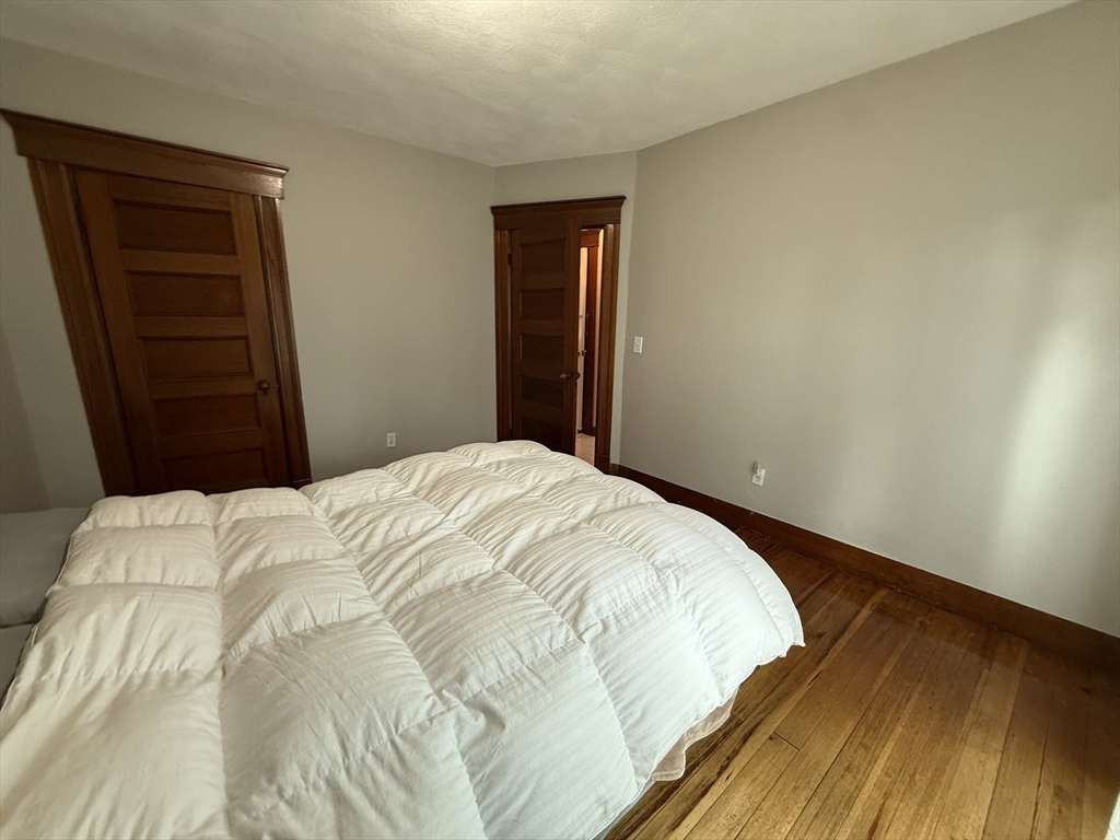 22 Yale Avenue, Unit A Wakefield, MA 01880 - Photo 9 of 23 a bedroom with a bed and dresser