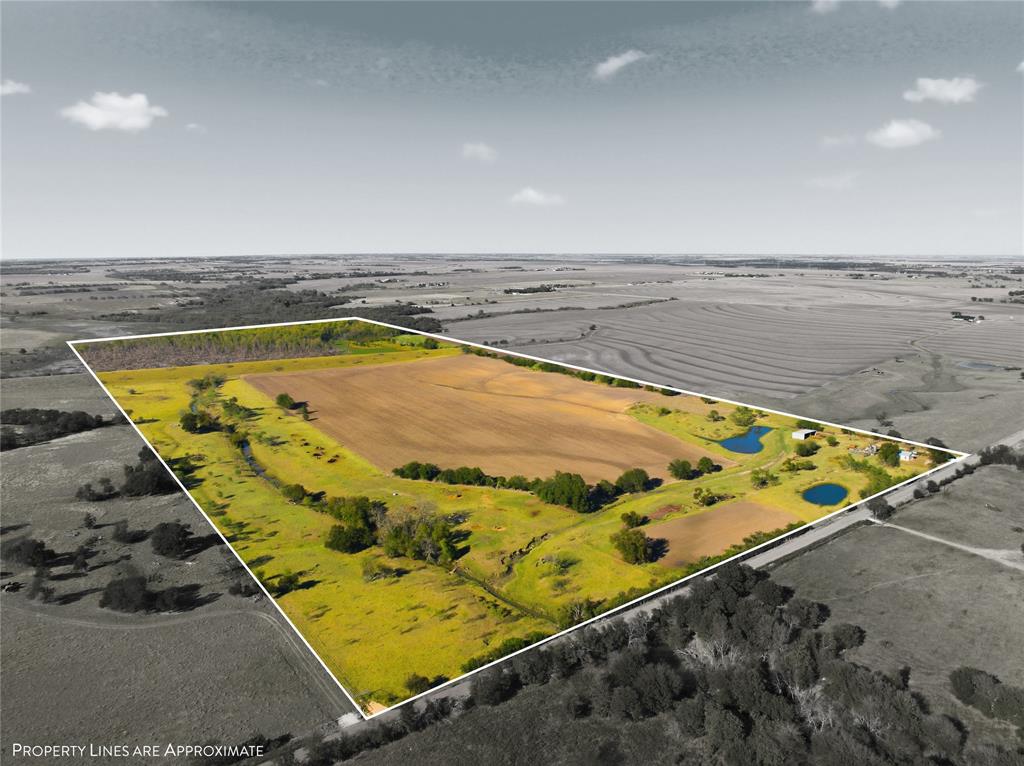 2663 West Crabb Road West, TX 76691 - Photo 2 of 22 View of rural area with property parcel outlined and a large body of water