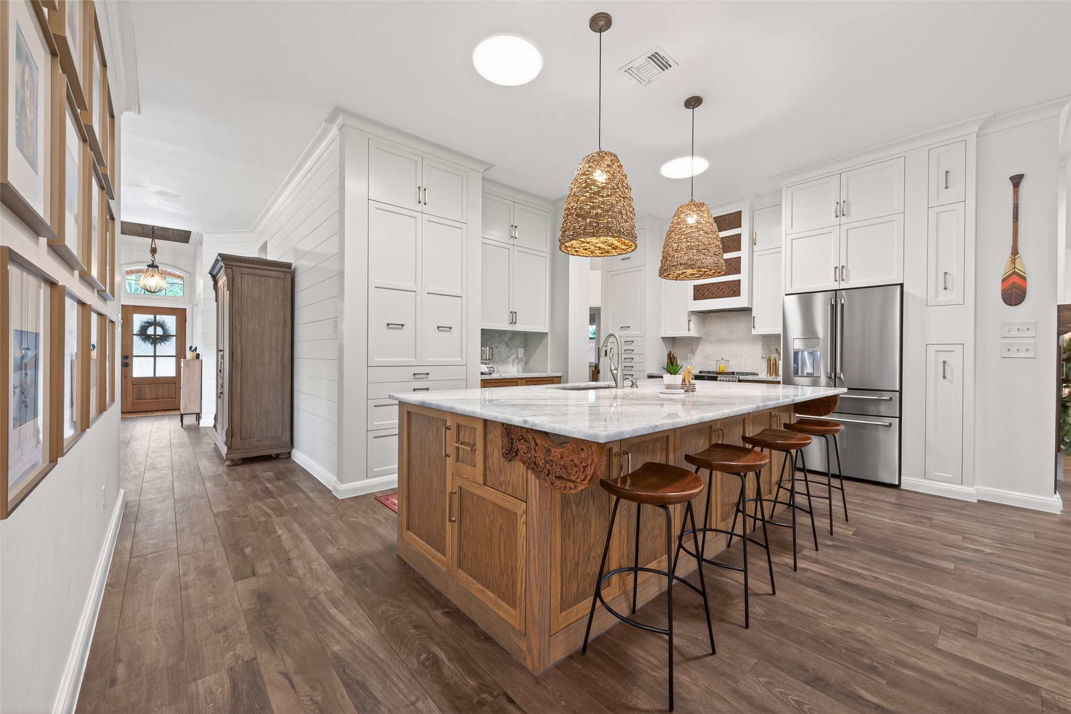 10 Belcarra Place Spring, TX 77382 - Photo 48 of 49 Huge Island Kitchen with stylish lighting, great seating space. Amazing flow in this floor plan!