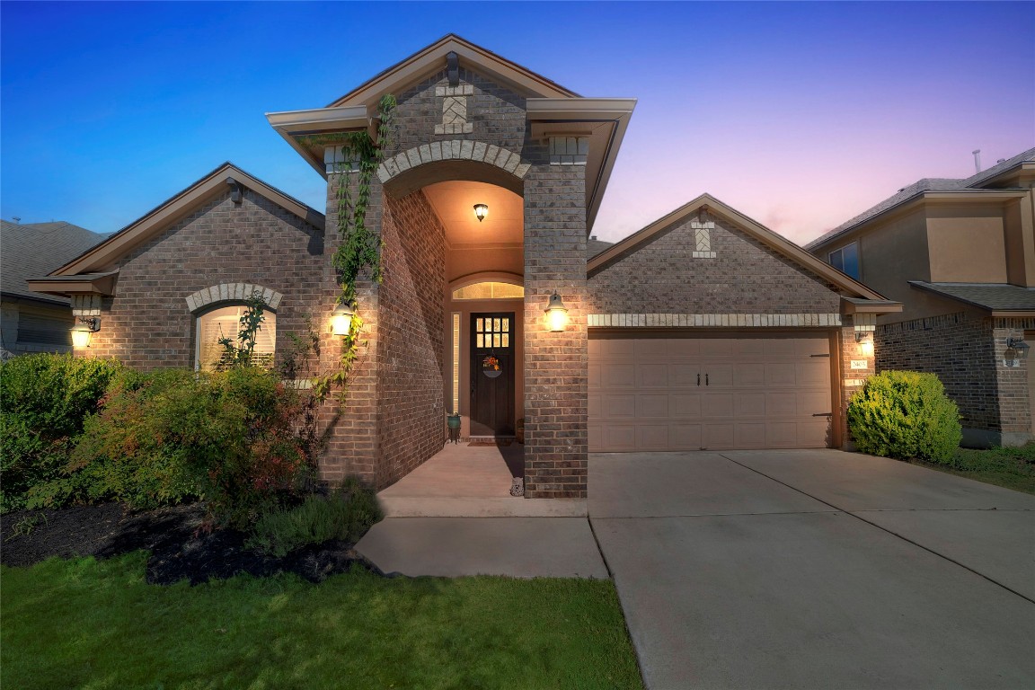 2405 Billy Pat Road Leander, TX 78641 - Photo 1 of 1 a front view of a house with garden