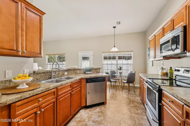 a kitchen with granite countertop lots of counter top space