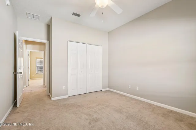 a bathroom with a wooden floor