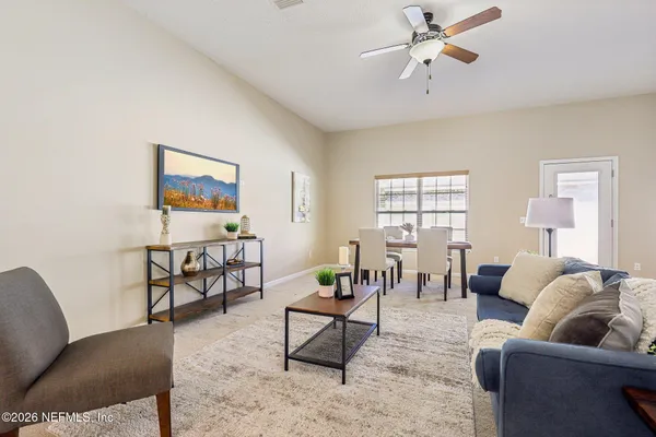 a living room with furniture and a window