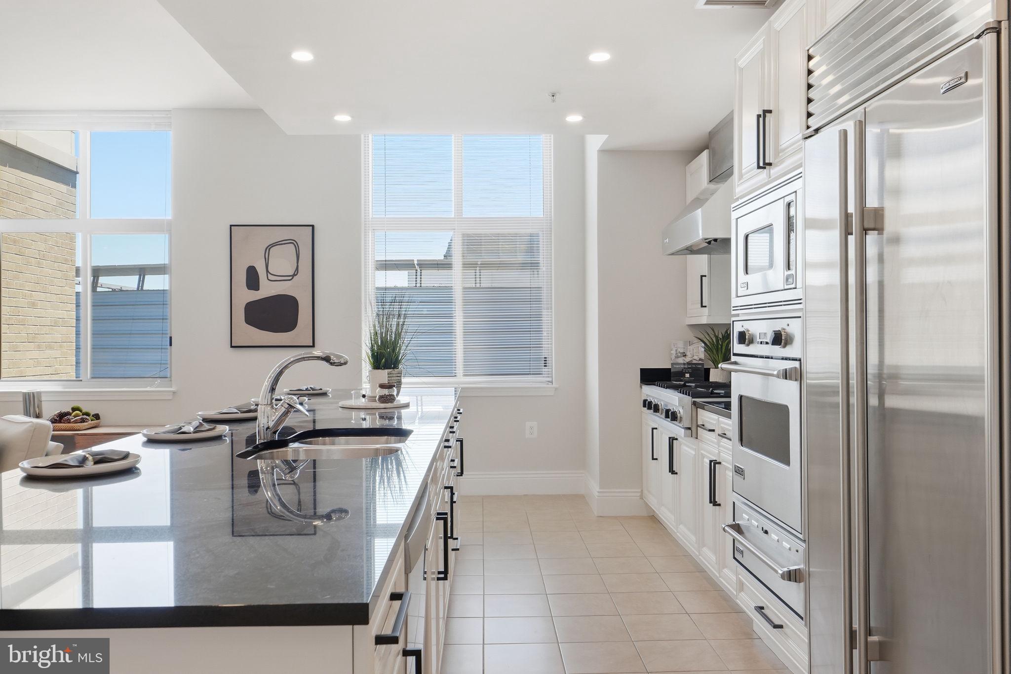 11990 Market Street, Unit 2103 Reston, VA 20190 - Photo 13 of 78 Bright, modern kitchen with sleek design.