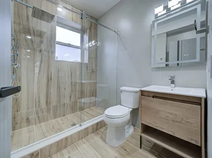a view of hallway with wooden floor
