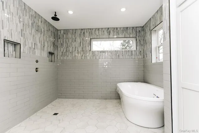 a bathroom with a toilet and shower