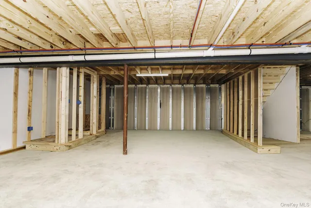 an empty room with wooden walls