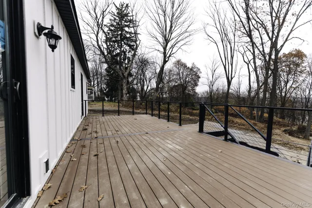 a view of a backyard with large trees
