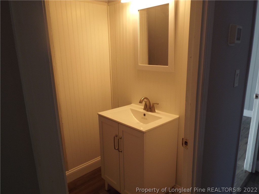 73 Georgia Way Cameron, NC 28326 - Photo 19 of 28 a bathroom with a sink and mirror
