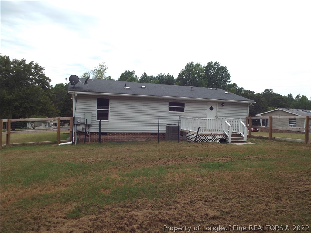 73 Georgia Way Cameron, NC 28326 - Photo 2 of 28 a house view with a garden space