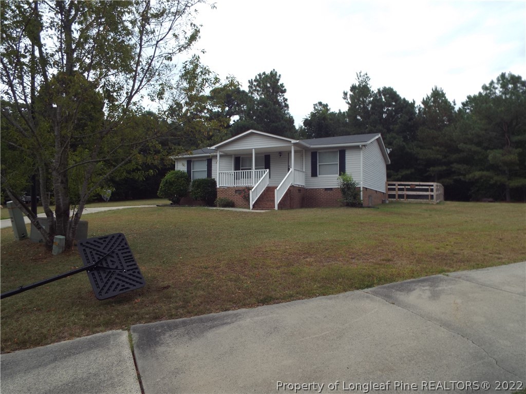 73 Georgia Way Cameron, NC 28326 - Photo 28 of 28 a view of a house with a yard