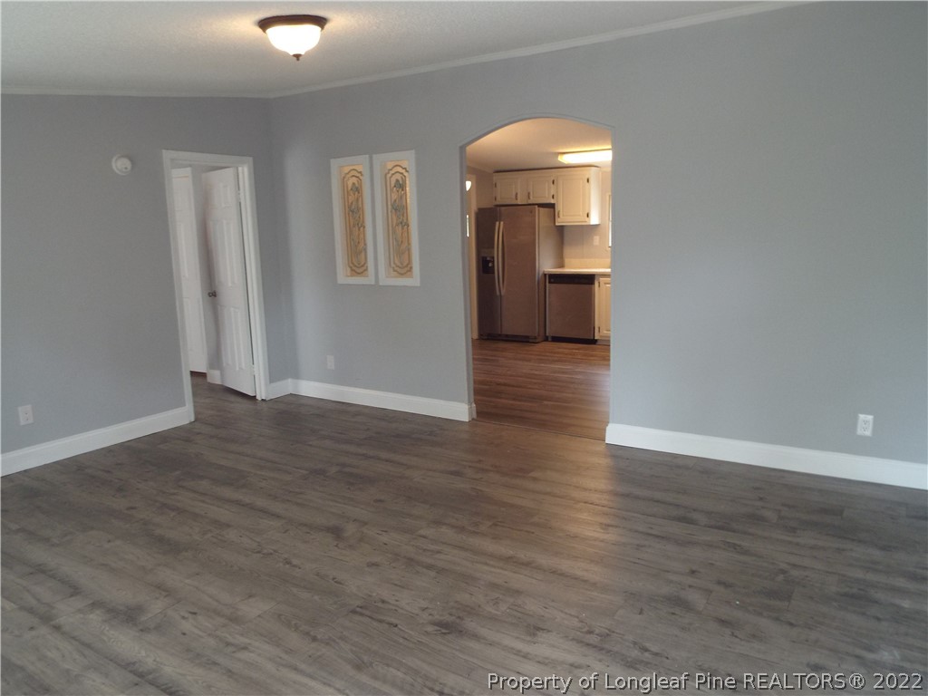 73 Georgia Way Cameron, NC 28326 - Photo 5 of 28 a view of empty room with wooden floor and fan