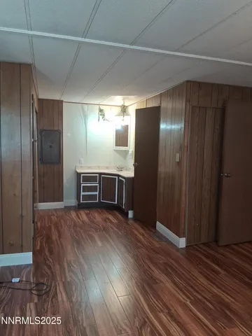 a view of a livingroom with wooden floor