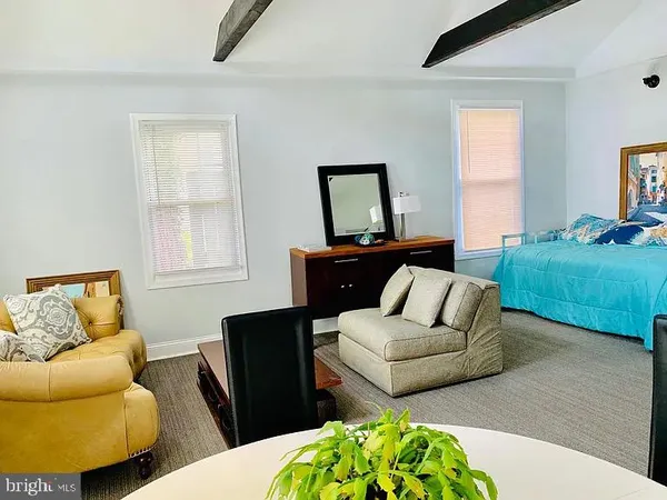 a living room with furniture and a couch