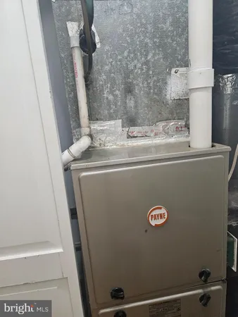 a kitchen with stainless steel appliances a sink dishwasher stove refrigerator and cabinets