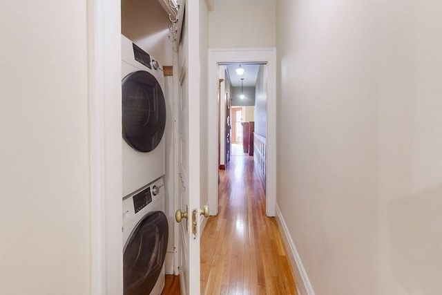 a view of a hallway with washer and dryer