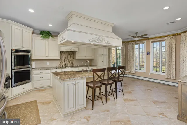 a view of a kitchen with a sink and living room