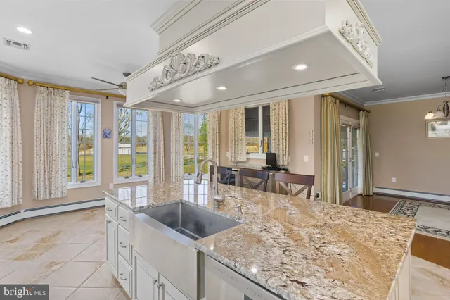 a spacious bathroom with a granite countertop tub sink and mirror