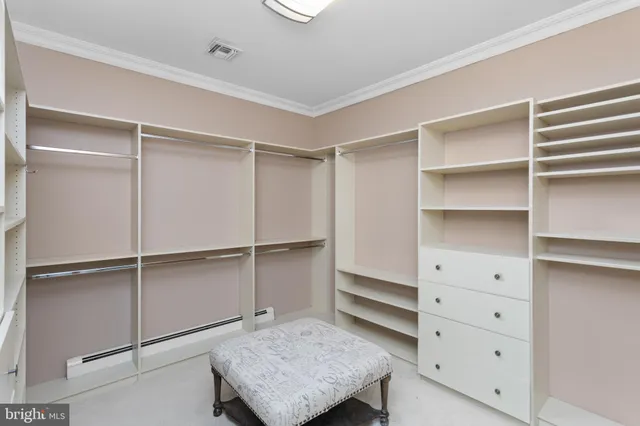 a bathroom with a granite countertop sink a mirror and a bathtub