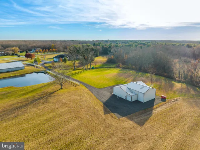 an aerial view of a house with a ocean view