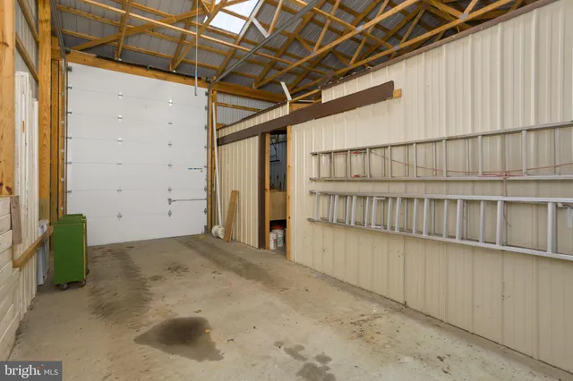 an aerial view of a house with a lake view