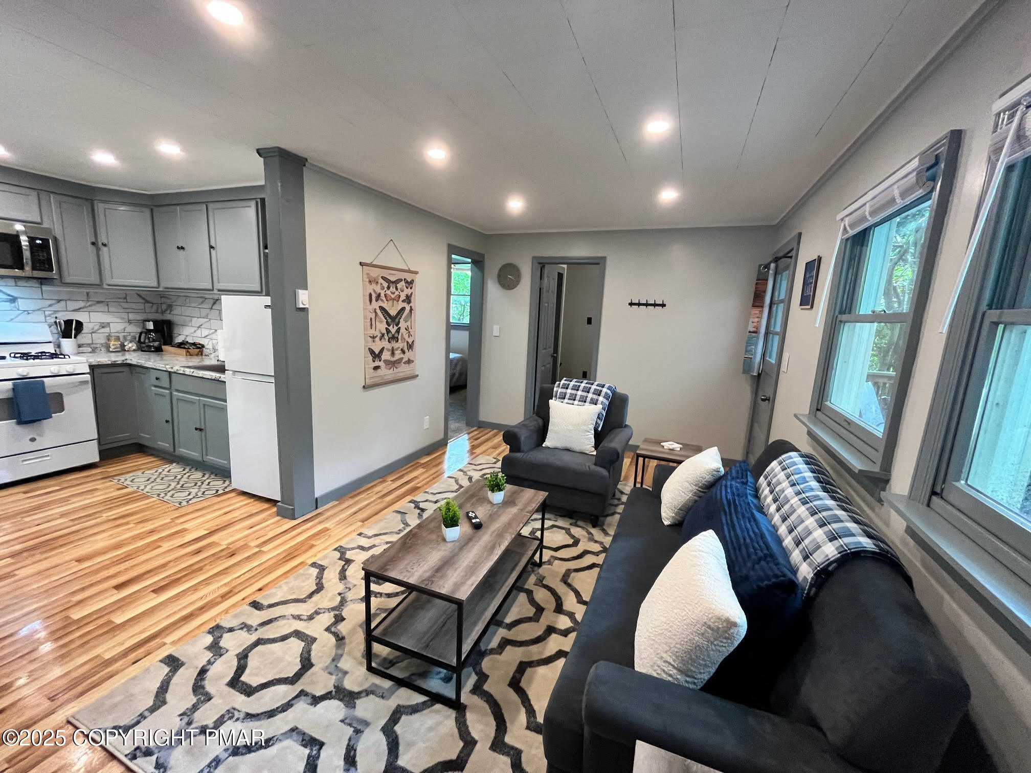 4 1st Street Hawley, PA 18428 - Photo 14 of 32 a living room with furniture and a table
