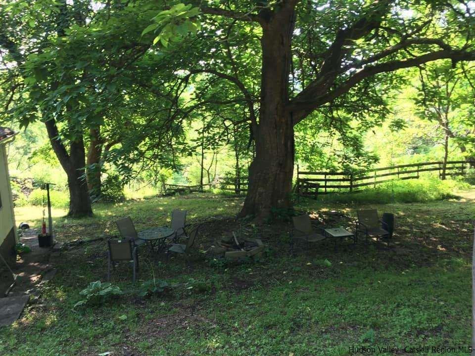 163 Churchland Road Saugerties, NY 12477 - Photo 19 of 20 a backyard of a house with lots of green space