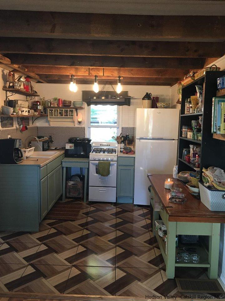 163 Churchland Road Saugerties, NY 12477 - Photo 3 of 20 a kitchen with a stove and a refrigerator