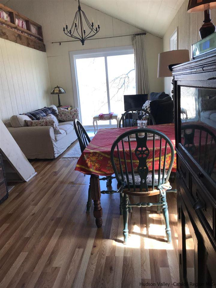 163 Churchland Road Saugerties, NY 12477 - Photo 5 of 20 a view of a dining room with furniture window and outside view