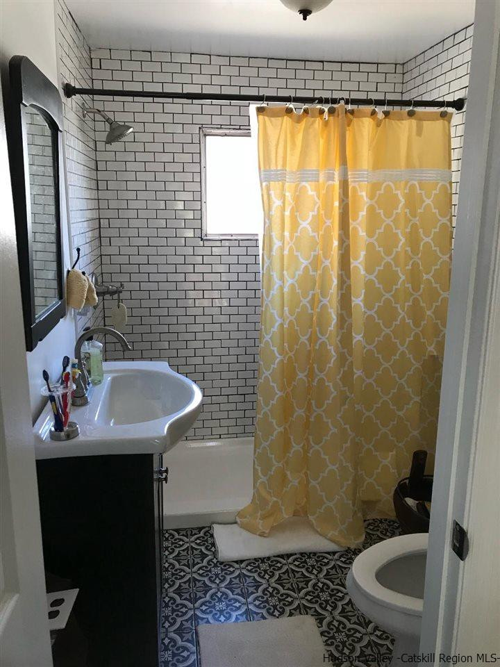 163 Churchland Road Saugerties, NY 12477 - Photo 7 of 20 a bathroom with a sink and a mirror