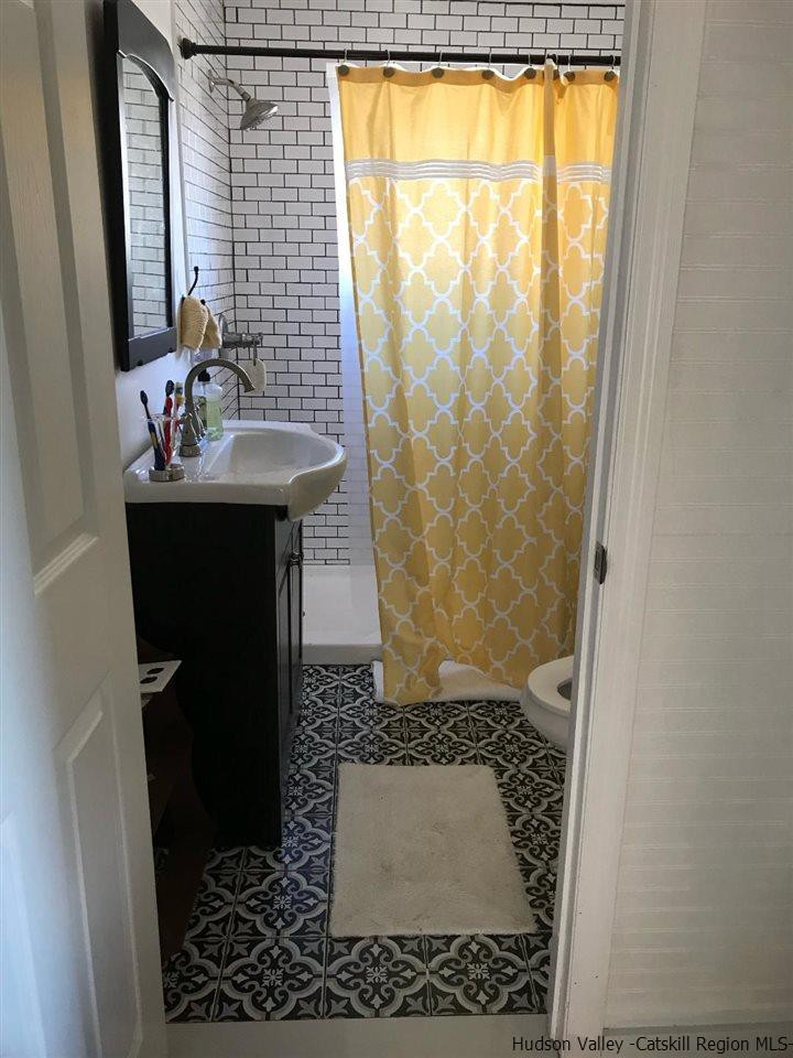 163 Churchland Road Saugerties, NY 12477 - Photo 8 of 20 a bathroom with a sink and a mirror